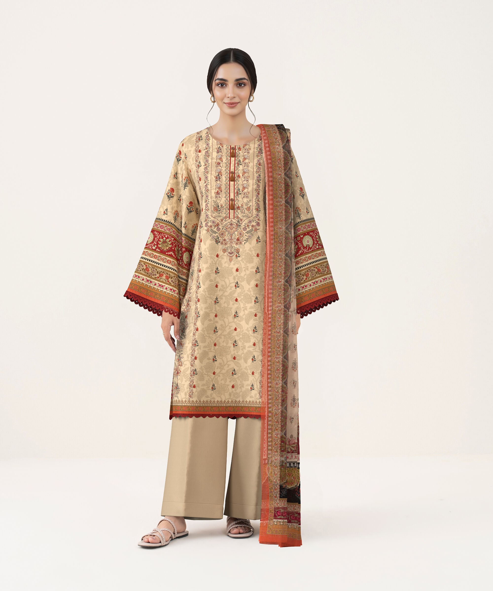 Beige embroidered three piece with a red-bordered dupatta